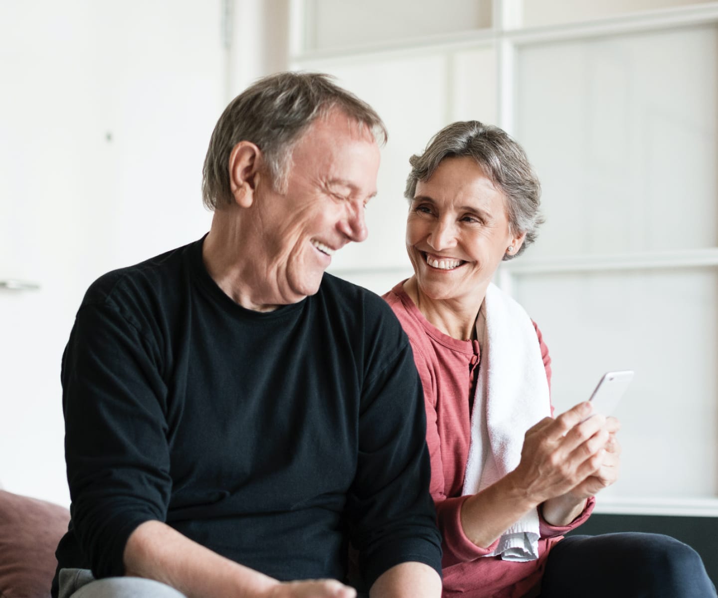 Man and woman looking at phone