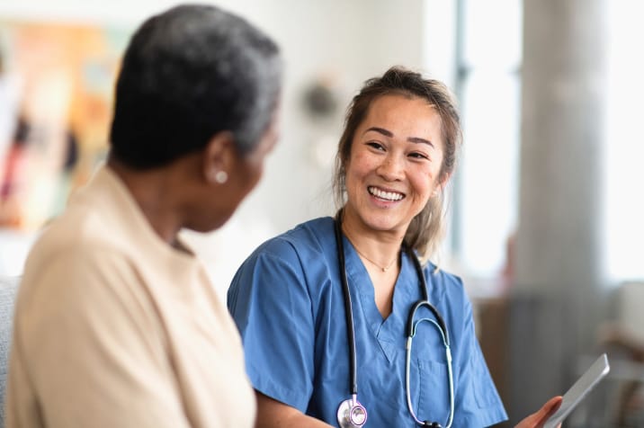 Nurse helping patient